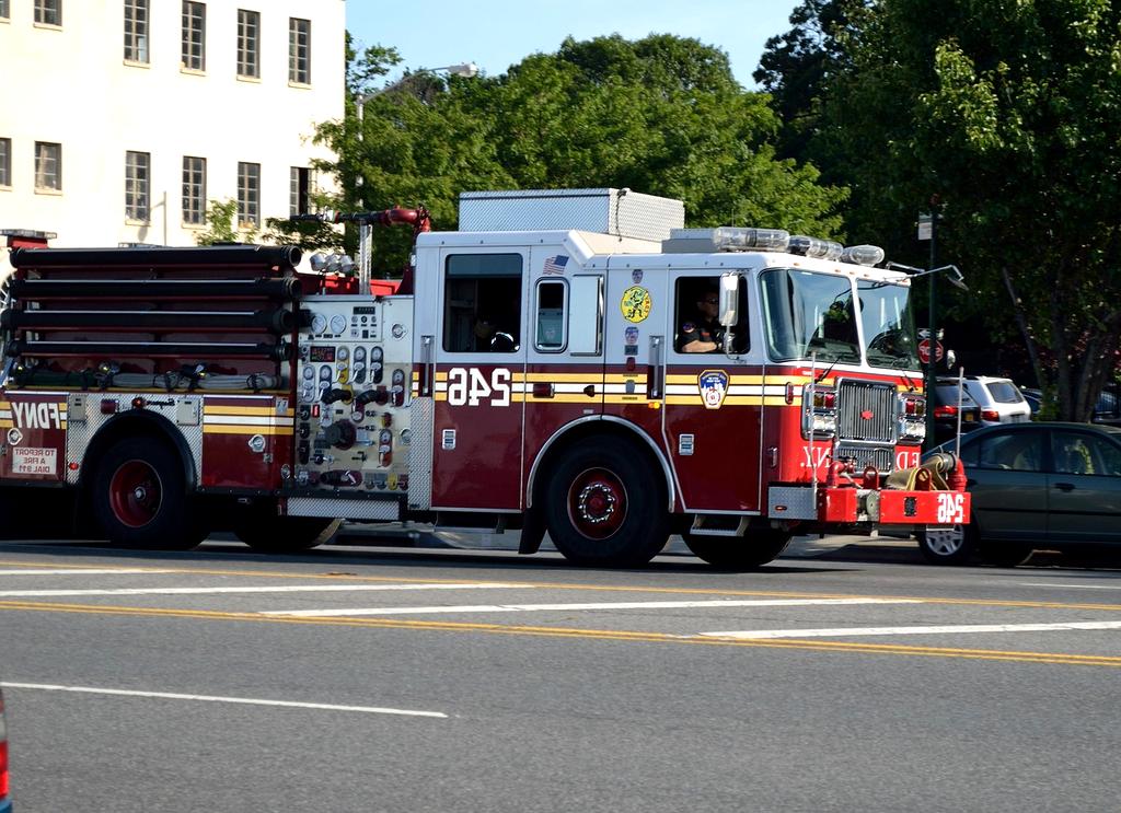 Incident response team analyzing security breach with multiple monitors and data